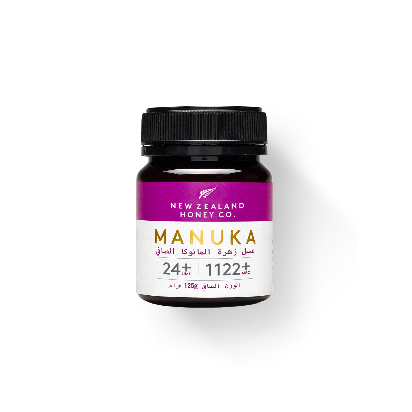 UMF 24+ MGO 1122+ Manuka honey 500g jar with bamboo spoon on black background