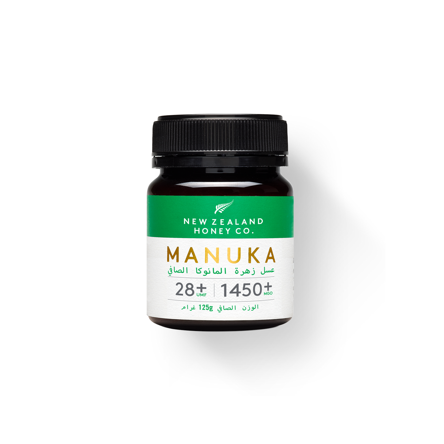UMF 28+ MGO 1450+ Manuka honey 125g jar with green Arabic-English label on white
