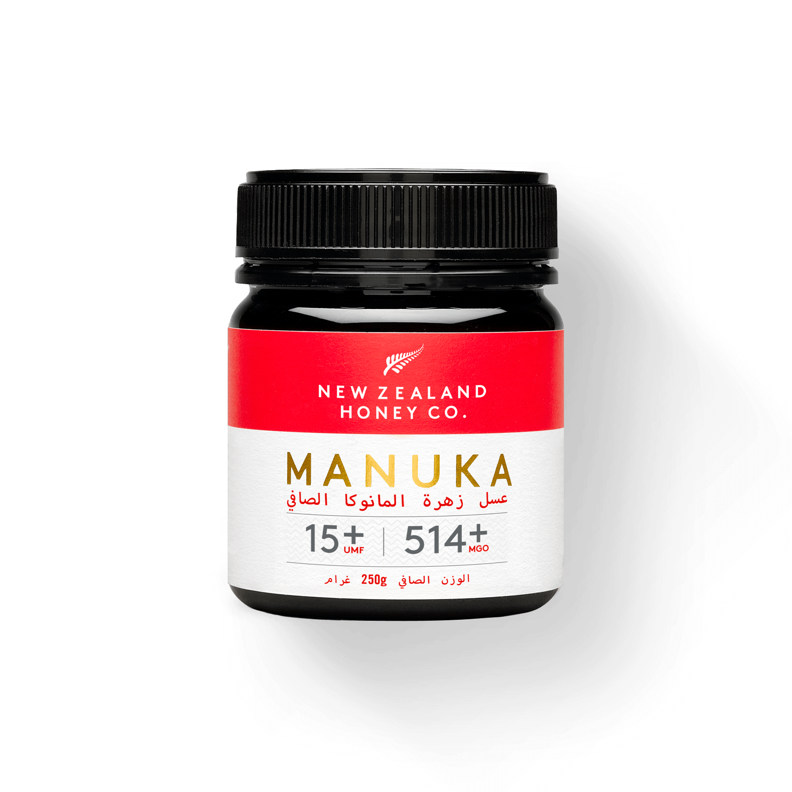 UMF 15+ MGO 514+ Manuka honey 250g jar with branded bamboo honey spoon on black