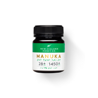UMF 28+ MGO 1450+ Manuka honey 125g jar with green Arabic-English label on white