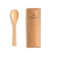Bamboo Daily Spoon next to a kraft paper sleeve with the NZHC logo