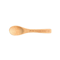 Top-down view of the bamboo Daily Spoon engraved with New Zealand Honey Co.