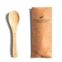 Bamboo Daily Spoon beside its kraft paper gift envelope with NZHC branding