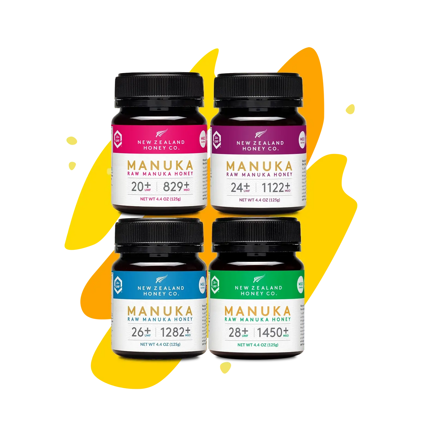 Four Manuka Honey Minis jars (UMF 20+, 24+, 26+, 28+) on yellow splash background